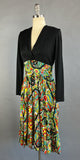 1960s Paisley Dress / Bold Floral Paisely Long Sleeved Day Dress with Black Cross Body Bodice and Full Ruffled Skirt / Size Large