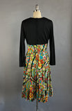 1960s Paisley Dress / Bold Floral Paisely Long Sleeved Day Dress with Black Cross Body Bodice and Full Ruffled Skirt / Size Large